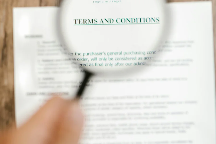 A magnifying glass over a Terms and Conditions document